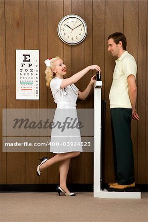 Caucasian mid-adult female nurse weighing man on scale.