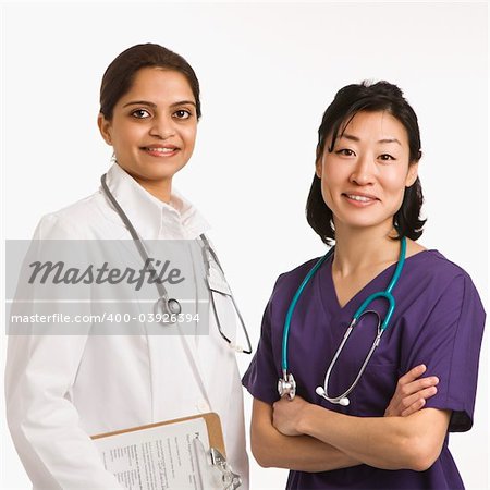 Indian and Asian mid adult woman doctors portrait on white background.