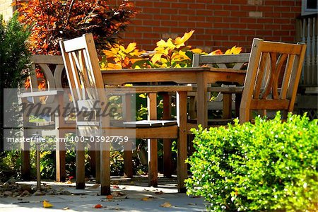 House patio with natural wooden patio furniture