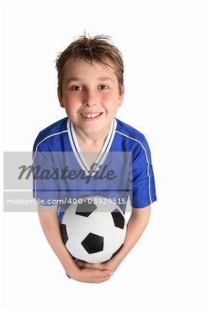 A young boy in soccer uniform ready to play soccer.