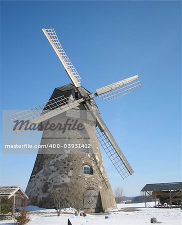 Wind mill with wood wings under snow in winter