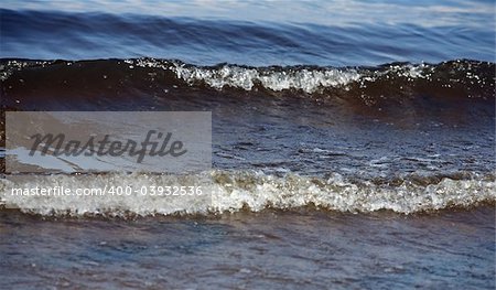 The image of dark blue water with waves