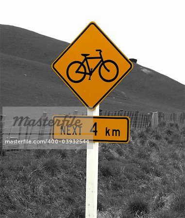 A rural bike sign an a black & white background. Clipping path provided