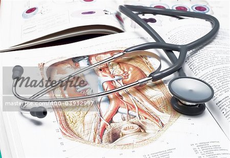 Stethoscope on a medical book isolated on white