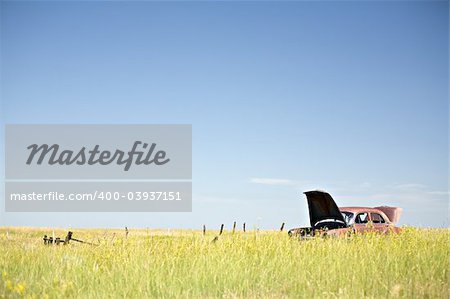 abandoned car in a field, rural Wyoming