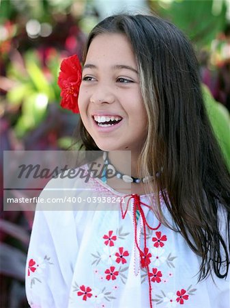 Smiling girl in a tropical garden