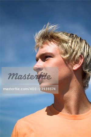 man close up portrait over deep blue sky