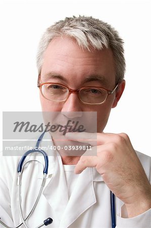 concentrated doctor in glasses with stethoscope looking to the camera