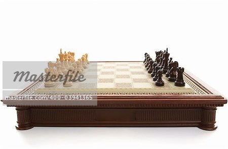 Chess board and wooden playing pieces