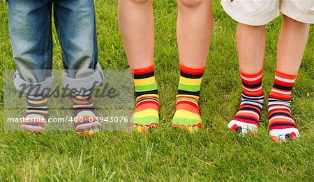 Three kids Wearing Multi colored Toe Socks
