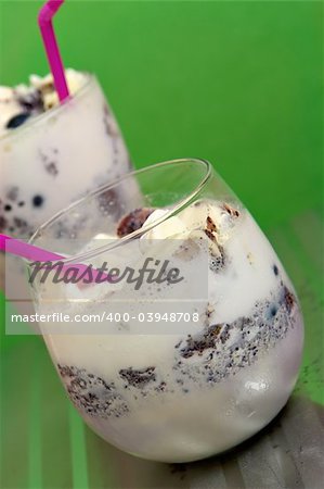 Served Blueberry meringue crumbles with straws