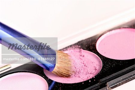 Eyeshadow and brush macro closeup