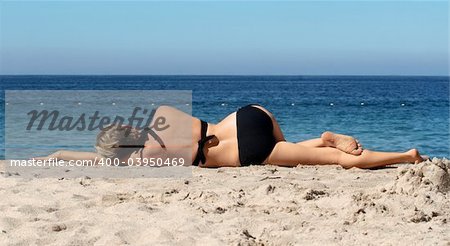 Woman resting on a beach