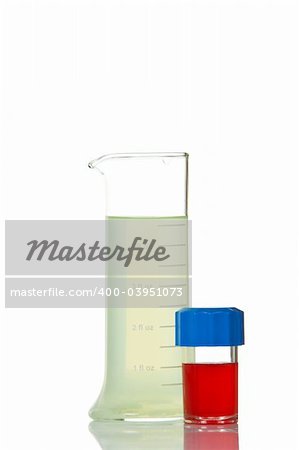 A test flasks with blue and red liquid, reflected on white background