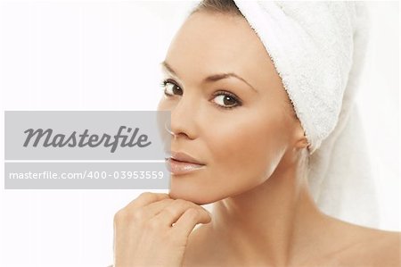 Portrait of Fresh and Beautiful brunette woman wearing white towel on her head