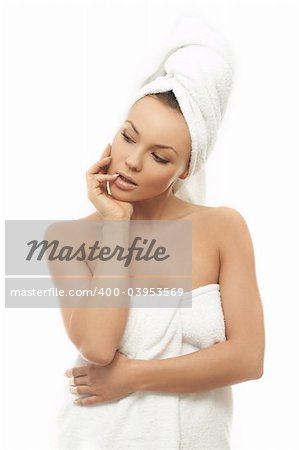 Portrait of Fresh and Beautiful brunette woman wearing white towel on her head