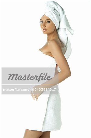 Portrait of Fresh and Beautiful brunette woman wearing white towel on her head