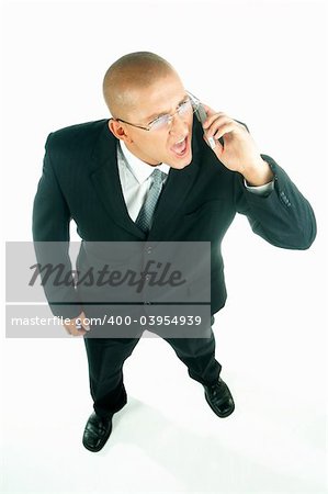 A young businessman with a blue tie and white shirt with cell phone