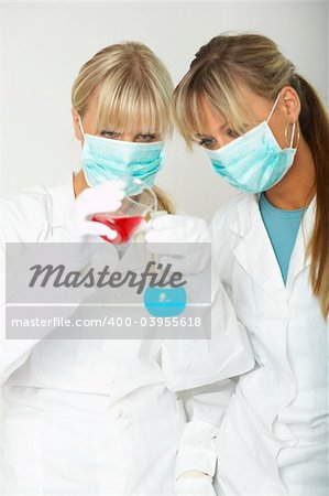 Female lab workers testing and experimenting