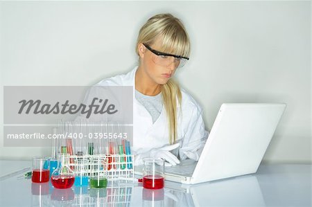 Beautifula female lab worker testing and experimenting