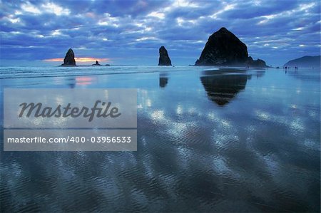 Evening at the Pacific Coast - sand, rocks, reflections