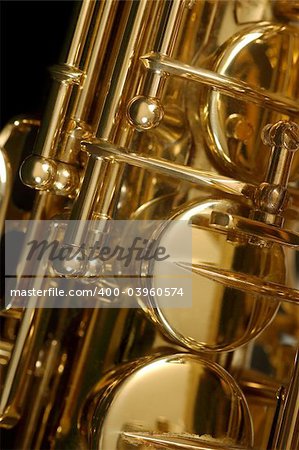 Macro image of the valves and keys of a saxophone.