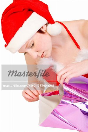 Beautiful girl dressed in a christmas lingerie set unwrapping a gift box With clipping path for your convenience