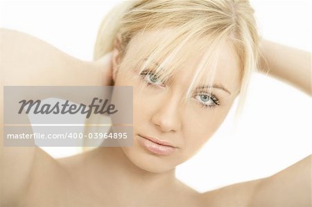 Portrait of Fresh and Beautiful young blond woman playing with her hair