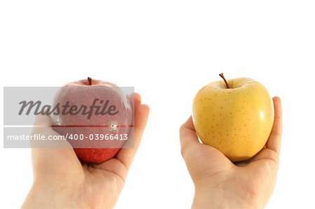 image of yellow and red apple in a girl hand