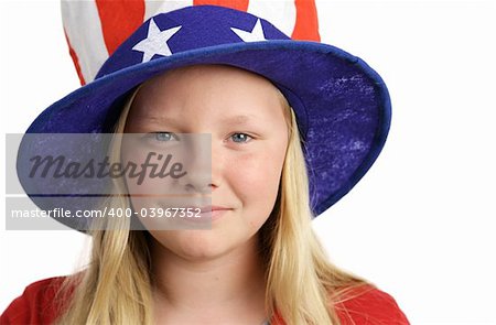 Portrait of a beautiful young American girl wearing a patriotic hat.  Isolated on white.