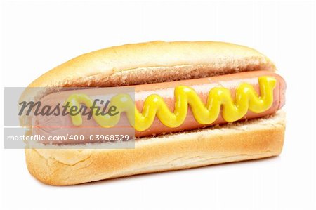 A hot dog with mustard and soft shadow on white background. Shallow DOF