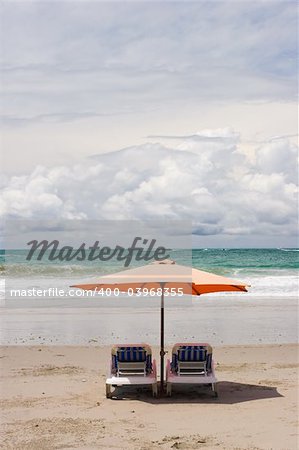 Two chairs and umbrella at the beach. Manuel Antonio, Costa Rica.