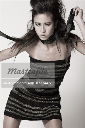 Studio portrait of a beautiful mixed race, vietnamese girl in your face