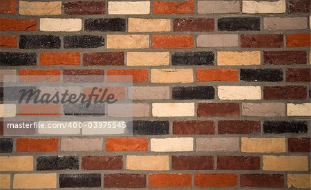 Brick wall background of various coloured bricks