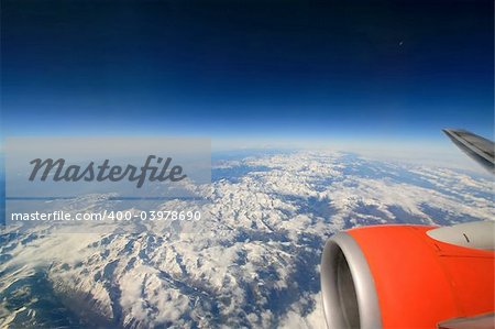 View on snowy mountains from the airplane