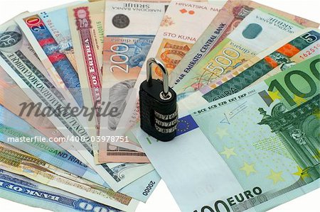 different countries money with a lock on white background