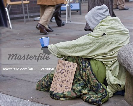 homeless man with sign