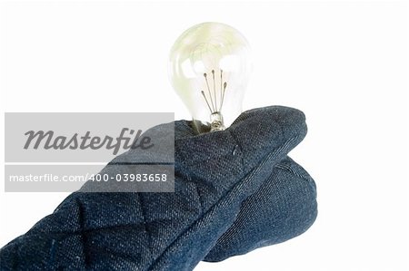 A light bulb being held by an oven mitt.  Isolated on white with clipping path.