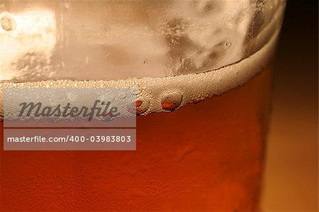 A closeup of an amber beer bottle.