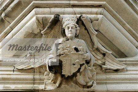 An architectural detail with an angel showing a family crest. This sculpture was located over the main door of an old mansion in the Irish countryside.