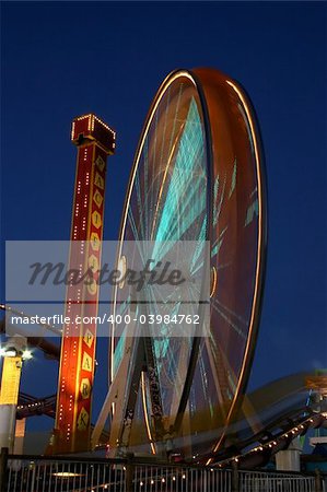 Night shot of the ferris wheel and coaster at the Santa Monica Pier.