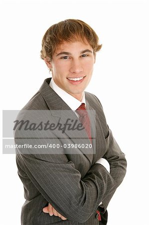 Confident, handsome young businessman.  Arms folded against a white background.