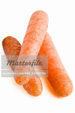 Three carrots on a white background.