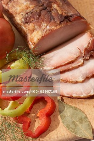 sliced ham on the wood board with