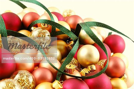 Pile of small Christmas ornaments with ribbon woven through