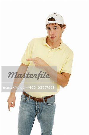 Handsome college age man pointing off camera.  Isolated on white.