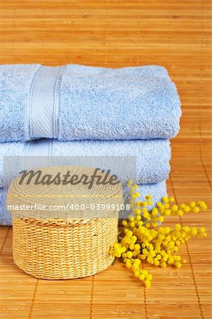 Bath accessories and beauty products on bamboo mat background. Shallow DOF