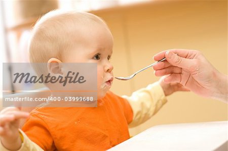 Feeding procedure of a little baby boy