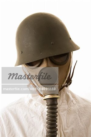 Person in gas mask and helmet on white background