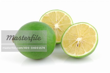 Fresh lime and halved in isolated white background